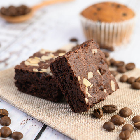 two pieces of Chocolate brownie and a cupcake