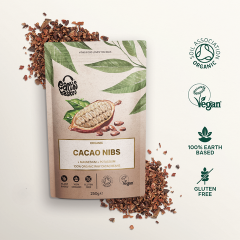 A package of Cacao Nibs with text logos and splashed Cacao nibs