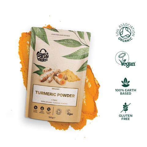 A packaging of Turmeric Powder with logos, text and splash of turmeric powder in the background
