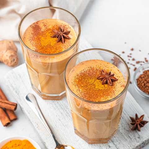 Two glasses of chai with spices